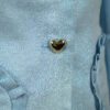 The fitted two-button jacket is made of iridescent linen/cotton blended fabric with metallic yarn