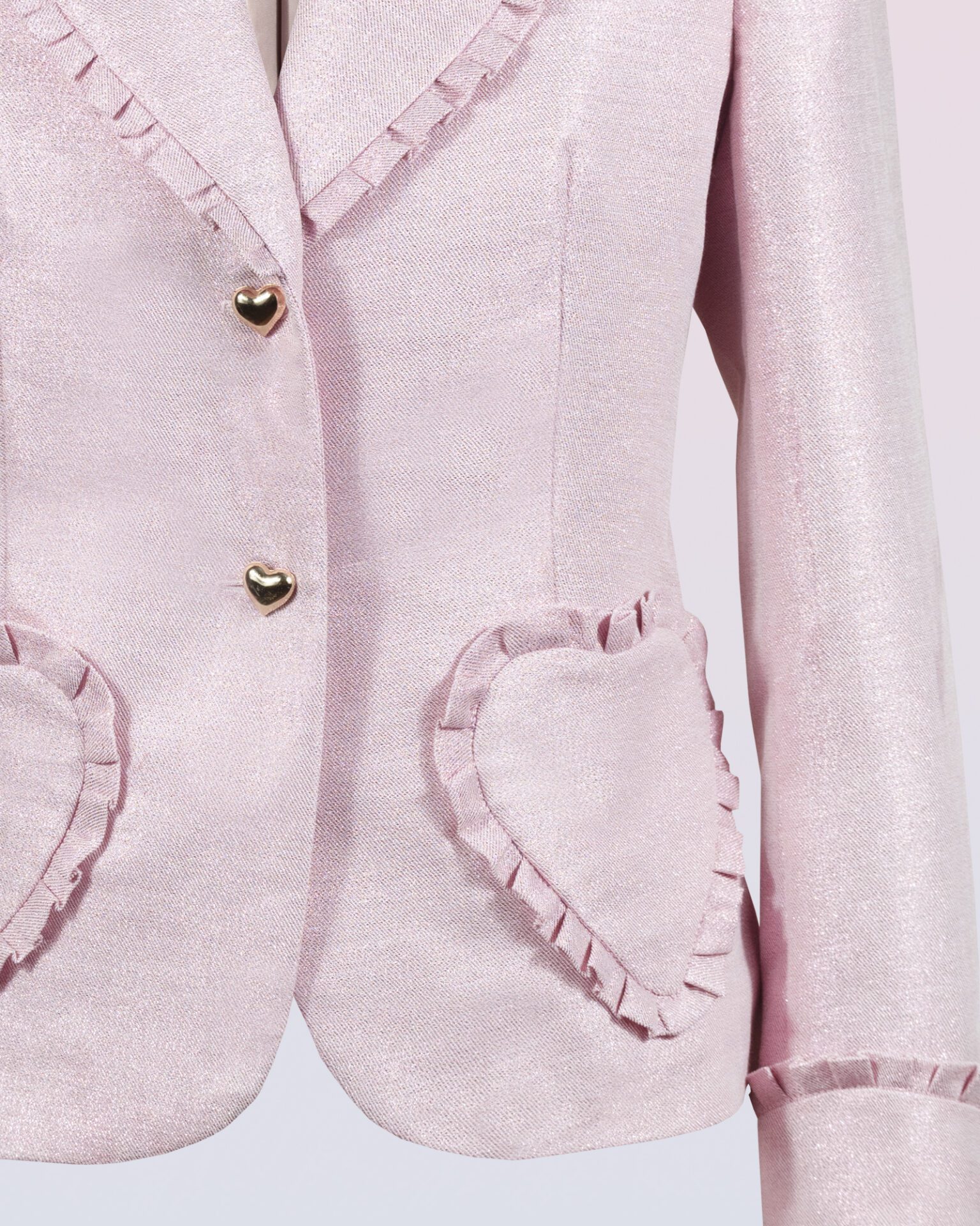 The fitted two-button jacket is made of iridescent linen/cotton blended fabric with metallic yarn