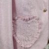 The fitted two-button jacket is made of iridescent linen/cotton blended fabric with metallic yarn