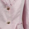 The fitted two-button jacket is made of iridescent linen/cotton blended fabric with metallic yarn