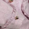 The fitted two-button jacket is made of iridescent linen/cotton blended fabric with metallic yarn